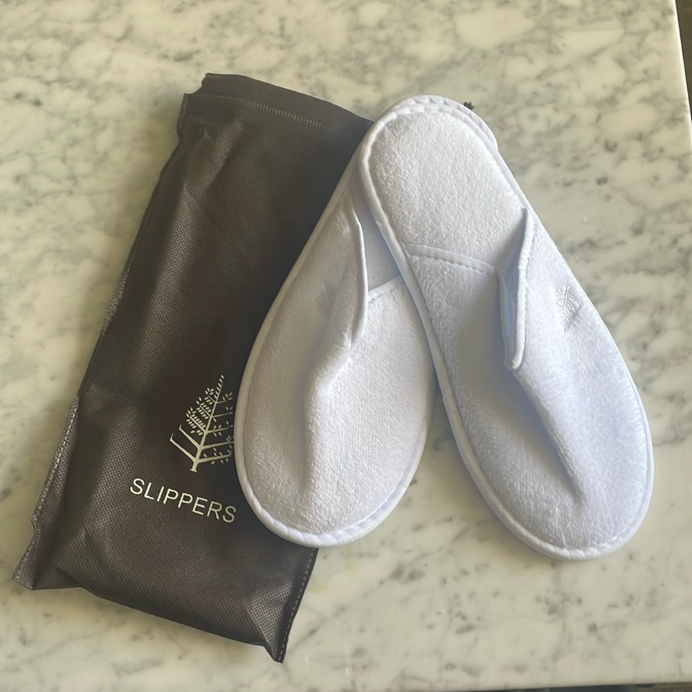 Four season’s house slippers size largerge white. New never worn with bag